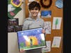 Smithtown Elementary School fifth grader Louis Shea with his award winning artwork.