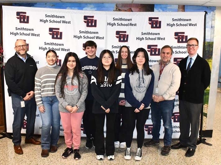 From left, Smithtown High School West Assistant Principal Dr. Freiberg, Paula Araujo Parra, Anabelle Kreitzman, Joseph Davide, Abigail Jung, Alyssa Griesman, Hannah Ren, Penumbra magazine advisers, Mr. Kuletsky and Mr. Gunsel.