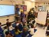 NYC firefighter Brian Infanzon, his wife, Gretchen Infanzon, visited Tackan Elementary School to read to students and answer their questions.