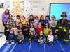 NYC firefighter Brian Infanzon, his wife, Gretchen Infanzon, visited Tackan Elementary School to read to students and answer their questions.
