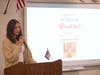 Olivia Wolber speaks at the podium. Local veterans and the late, Thomas Mooney, were honored at a breakfast hosted by Smithtown High School West’s Rho Kappa on April 12.