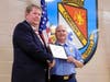 Mark Deeds and Craig Harman show their certification of recognition.