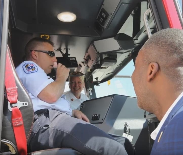 Howard County Executive Calvin Ball checks out the fire engine serving the new Merriweather Fire Station in Columbia.
