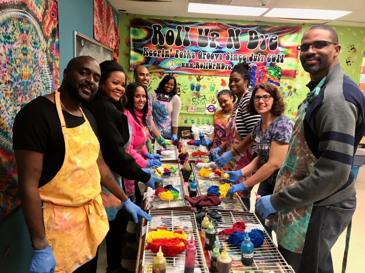 Clients engaged in team building exercises make shareable tapestries and cards for children undergoing medical treatments at the hospital.
