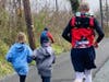 The wrestling coach and runner completed the 100-mile race in less than 22 hours, which included time for eating, changing clothes and stretching.