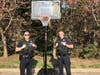 The officers were inspired to buy a new basketball hoop for the kids in the community.