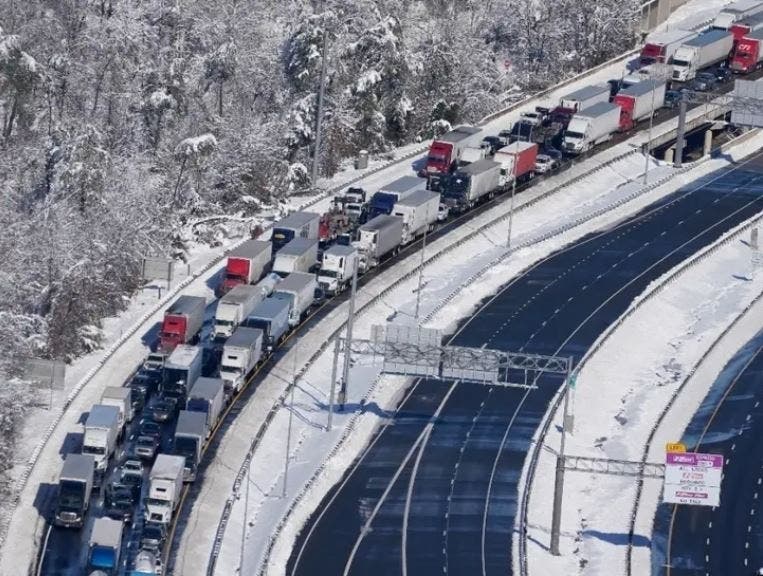 Cars and trucks were stranded on sections of Interstate 95 Jan. 4 near Quantico, Virginia, for nearly a day. Schmidt Baking Co. of Baltimore encouraged a Howard County couple to hand out baked goods from its stranded truck to feed hungry drivers.