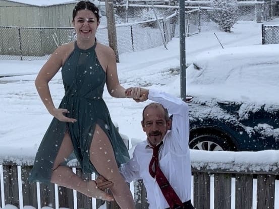 Baltimore County resident Margie Kolk shared a photo of her daughter and husband dancing in the snow, recreating a pose from when they were younger.