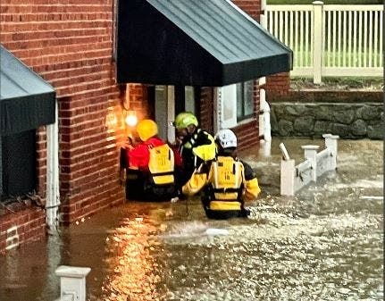 During Wednesday's slow-moving storm, firefighters rescued several people who were stranded by the floodwaters. 