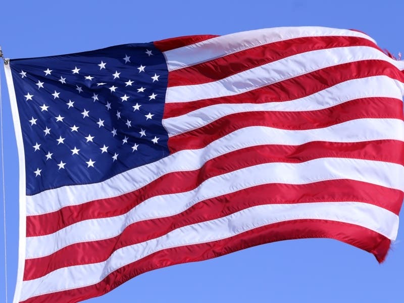 The flags are being delivered to National Harbor by veterans, bicyclists, runners and a Special Olympian gold medalist swimmer. 
