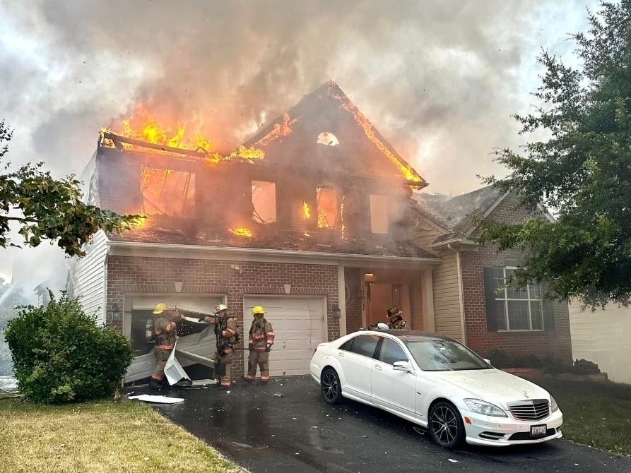 An early morning house fire in Laurel Wednesday damaged nearby houses, according to the Prince George's Fire and Emergency Medical Services Department.