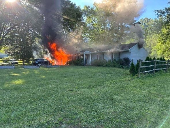 A woman living in a Kingsville home heard a smoke alarm going off, checked her living room and found smoke. She scoured the area for the source of the smoke and found a heavy fire burning in the attached garage. 