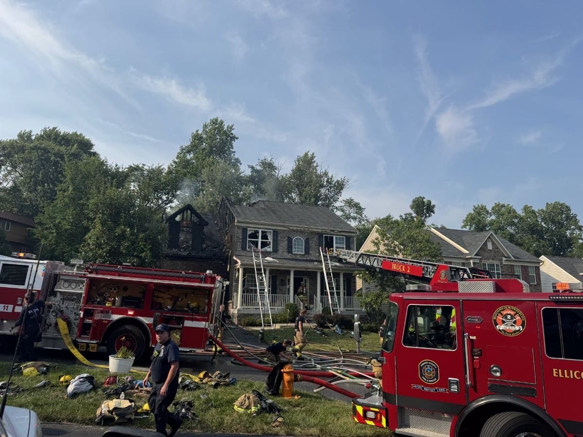 Firefighters and paramedics were dispatched to the home, located in the 4800 block of Wellstone Way in Elkridge, for a report of a house fire around 4:20 p.m. Emergency crews found flames shooting out of the home's attached garage and into the attic.