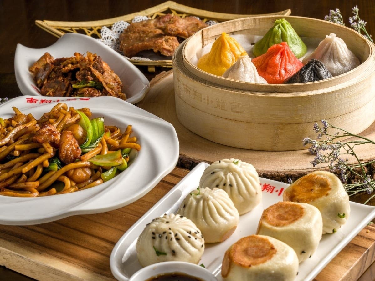 Nan Xiang Xiao Long Bao features an open-kitchen design where guests can watch chefs prepare soup dumplings. Each Xiao Long Bao is mixed, rolled, filled and hand-pleated before being steamed to order. 