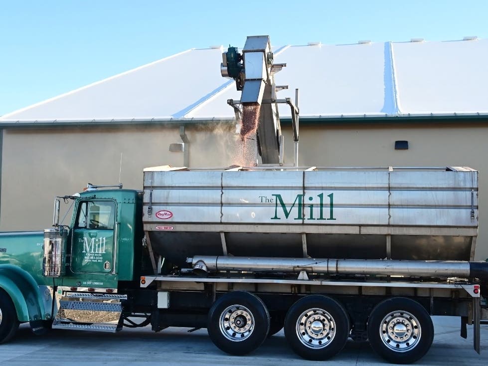 Local farmers, community partners and county officials gathered for the grand opening of the 12,000-square-foot facility, which doubles The Mill's fertilizer storage capacity to 2,000 tons and can triple outbound loading capacity.