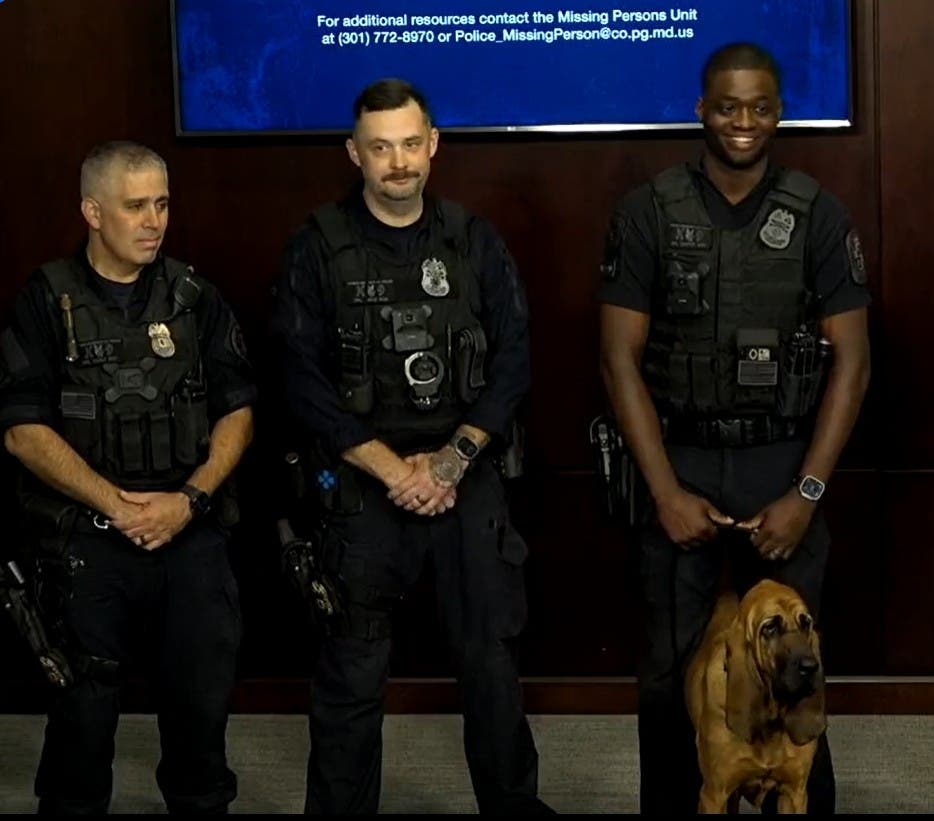 Prince George's County Police Cpl. Jason Carter, far right, and his 3-year-old bloodhound, Bo, joined patrol officers, Missing Persons Unit detectives and other members of the department's K-9 section to search for the boy Tuesday.