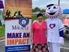 Karen Woys poses with Homer the Miracle League mascot who was on hand to support the fundraiser.
