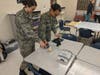 Cadets learn about robotics control with Sphero Star Wars droids.