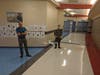 A larger drone is demonstrated using its auto start, auto liftoff, and auto landing functions