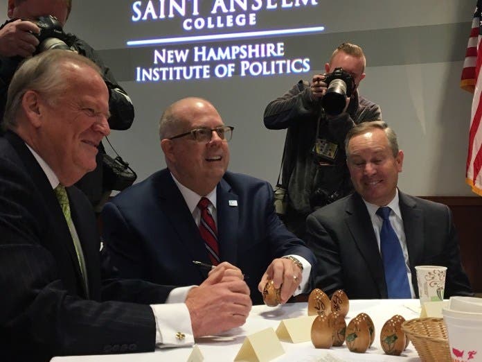 Gov. Lawrence J. Hogan Jr. (R) signs wooden eggs at Saint Anselm College in Manchester, N.H., earlier this year, a ritual for speakers at the college's "Politics and Eggs" series. Photo by Bruce DePuyt