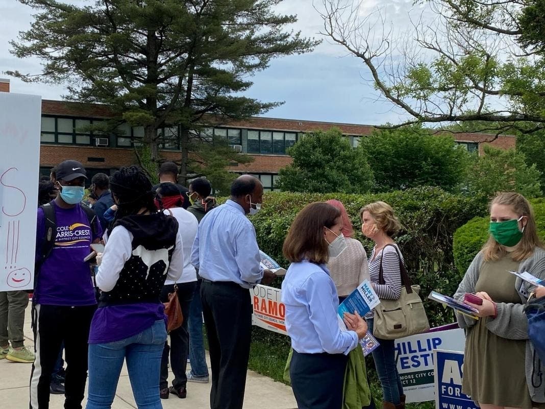 Baltimore mayoral candidates Mary Miller and Thiru Vignarajah greet voters at Northwood Elementary School Tuesday. 