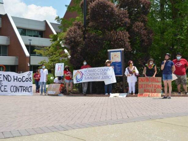 Protesters earlier this summer urge Howard County to end its contract with ICE.