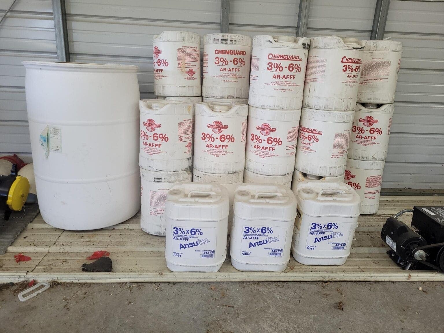 PFAS-containing firefighting foam sits in a storage area at the Mechanicsville Volunteer Fire Department in Southern Maryland. Firefighters have been barred from using the foam for about four years due to health concerns.