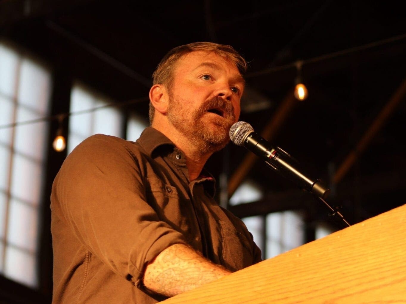 U.S. Senate candidate Graham Platner speaks to voters in Portland, Maine, May 25. Gov. Wes Moore joined other leading Democrats Tuesday, calling for Platner to drop out of the race after reports that he assaulted a former girlfriend.