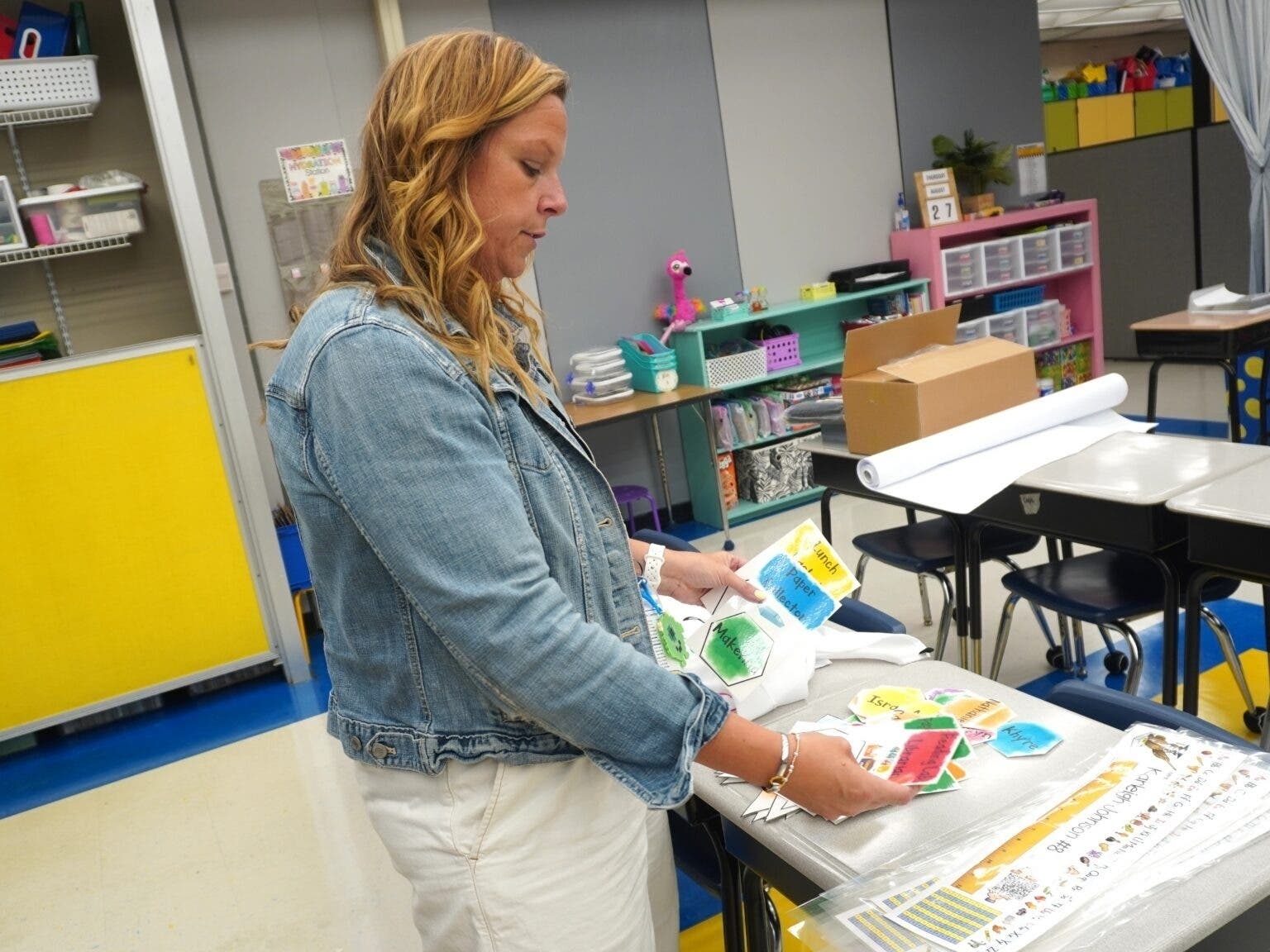 Pocomoke Elementary third-grade teacher Jennifer Copenhaver looks over the student job assignments Aug. 25 in preparation for the first day of school in Worcester County. 