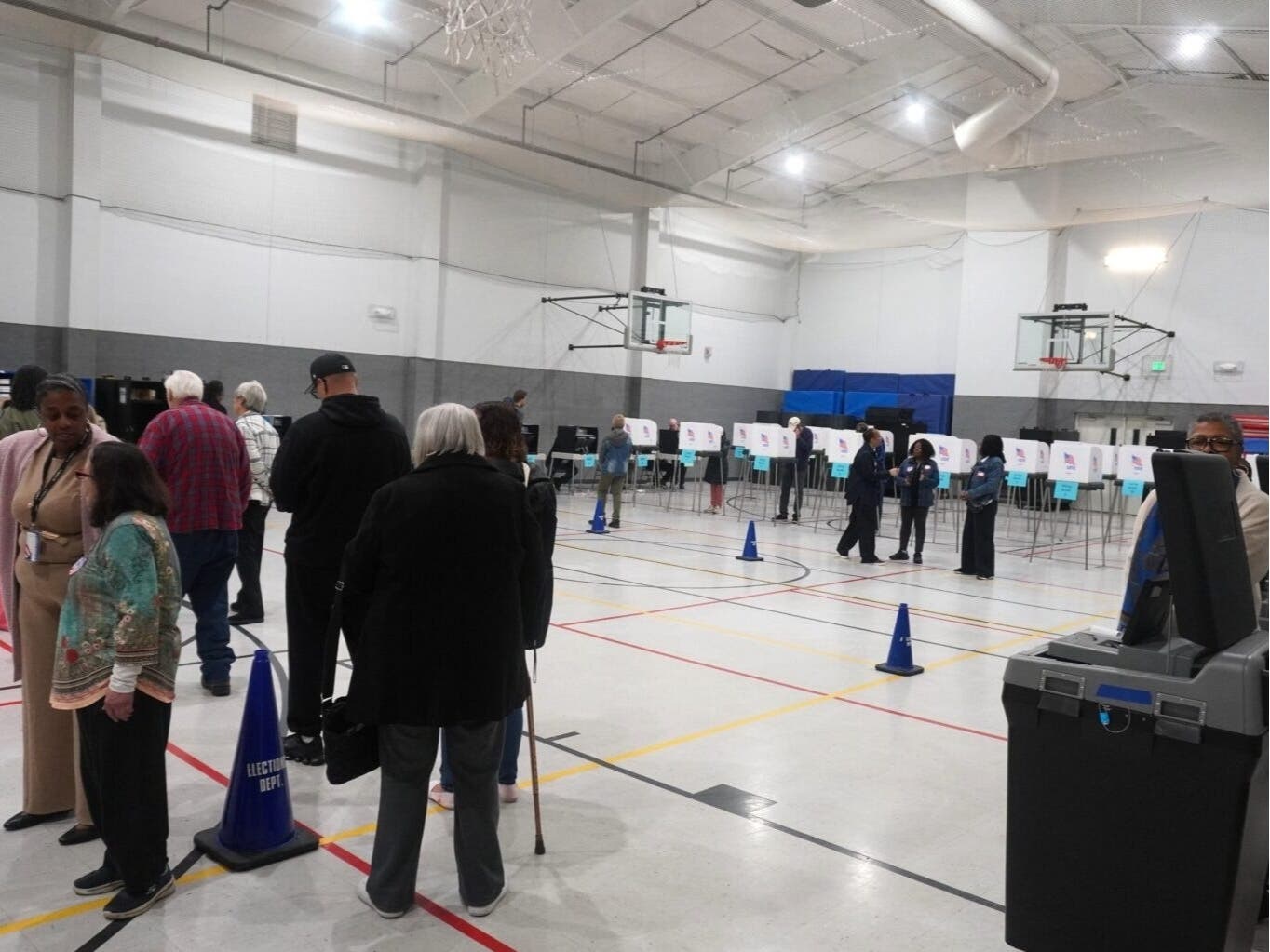 Voters line up to cast their ballots several minutes after doors opened Thursday at Honeygo Community Center in Baltimore County on the first day of early voting in Maryland. 