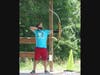 Scout at archery range