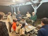 Scout gathered for instructional meeting on knife, axe, and saw usage, sharpening, and safety