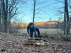 Scout Nathan preparing wood for cooking breakfast over the fire