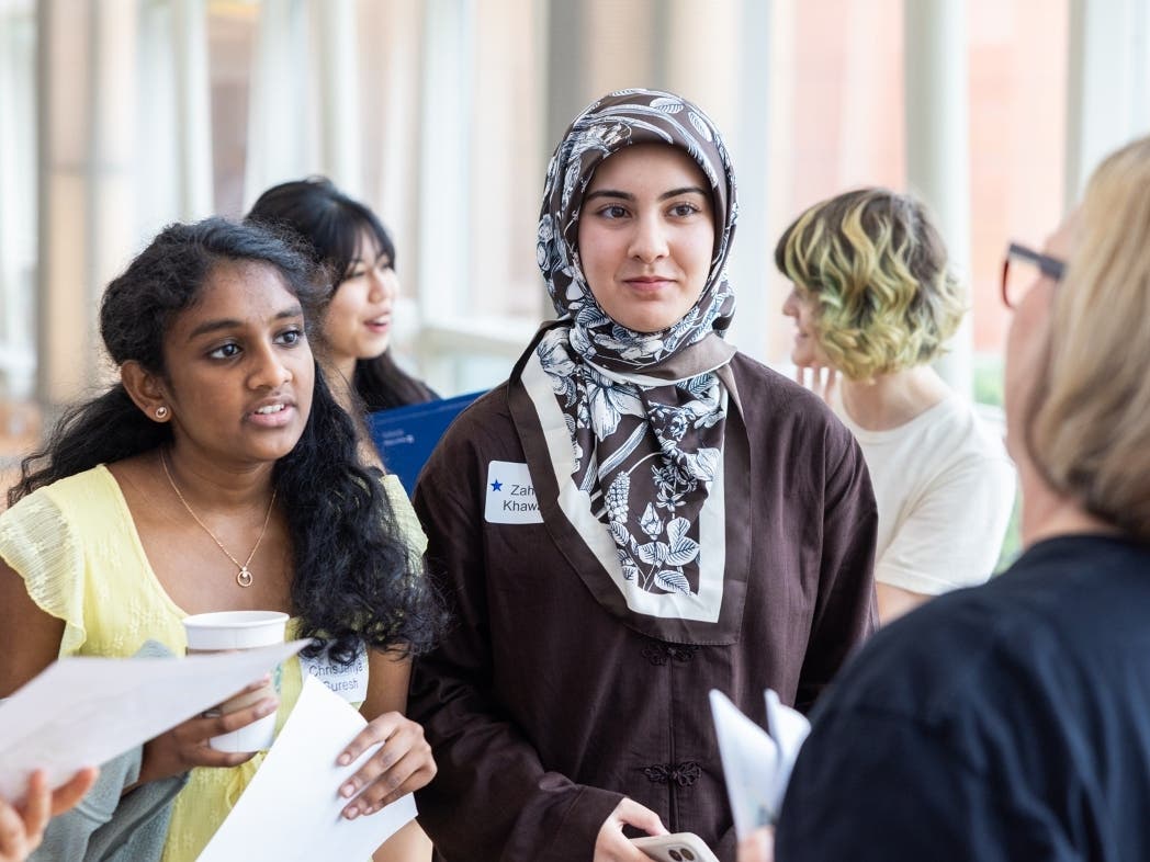 Chris Jenya Arokiya Suresh (left) and Zahra Khawari are juniors at Fremd High School and participants in the College Now program, which gives them the opportunity to simultaneously earn an associate degree and a high school diploma.