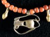 Carnelian beads, tiny gold 'nefer' (‘beautiful’) amulets & gold 'wedjat eye' pendant