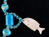 Necklace with faience beads and fish pendant crafted from bone