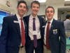 (Left to right) Andrew Danziger, Mark Yukelis, and Dante Howard smiling after workshops. 
