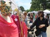 A customer looks at scarves by Quriandino Company at Artisan Market in Winnetka on Saturday May 30, 2026.