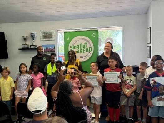 Students, families and SOAR staff celebrate after completing 12-week program and significantly increasing their reading skills.