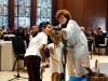 Rev. Cynthia Cochran-Carney, Pastor, invites the children to look through binoculars as part of her sermon “Scrapbooks and Binoculars” on Sept. 22