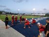 Gables O-line coach Carlos Abril warming up the Cavaliers big men