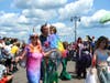 The family dressed up in the costumes in the Mermaid Parade down Boardwalk in Coney Island, Saturday, June 22, 2019. 