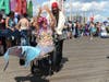 A parade participant on the wheelchair in the Mermaid Parade down Boardwalk in Coney Island, Saturday, June 22, 2019.