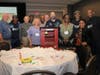 Foresters Financial and Fathers Incorporated Team Members pose with decorated Little Free Library 