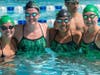 The 15-18 girls relay team smiles before their win in the 200 meter medley relay
