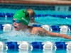Tyler Harris swims for first place in the butterfly