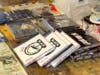 CDs and other artist merchandise are offered for sale 