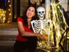 Kelly Fitzsimmons, owner of Light Up Your Holidays, with Skeleton.