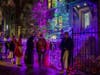 Trick or Treaters enjoying treats and festive Halloween decorations by Light Up Your Holidays.