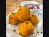 Arancini Milanese: Saffron rice balls with mozzarella & green peas.